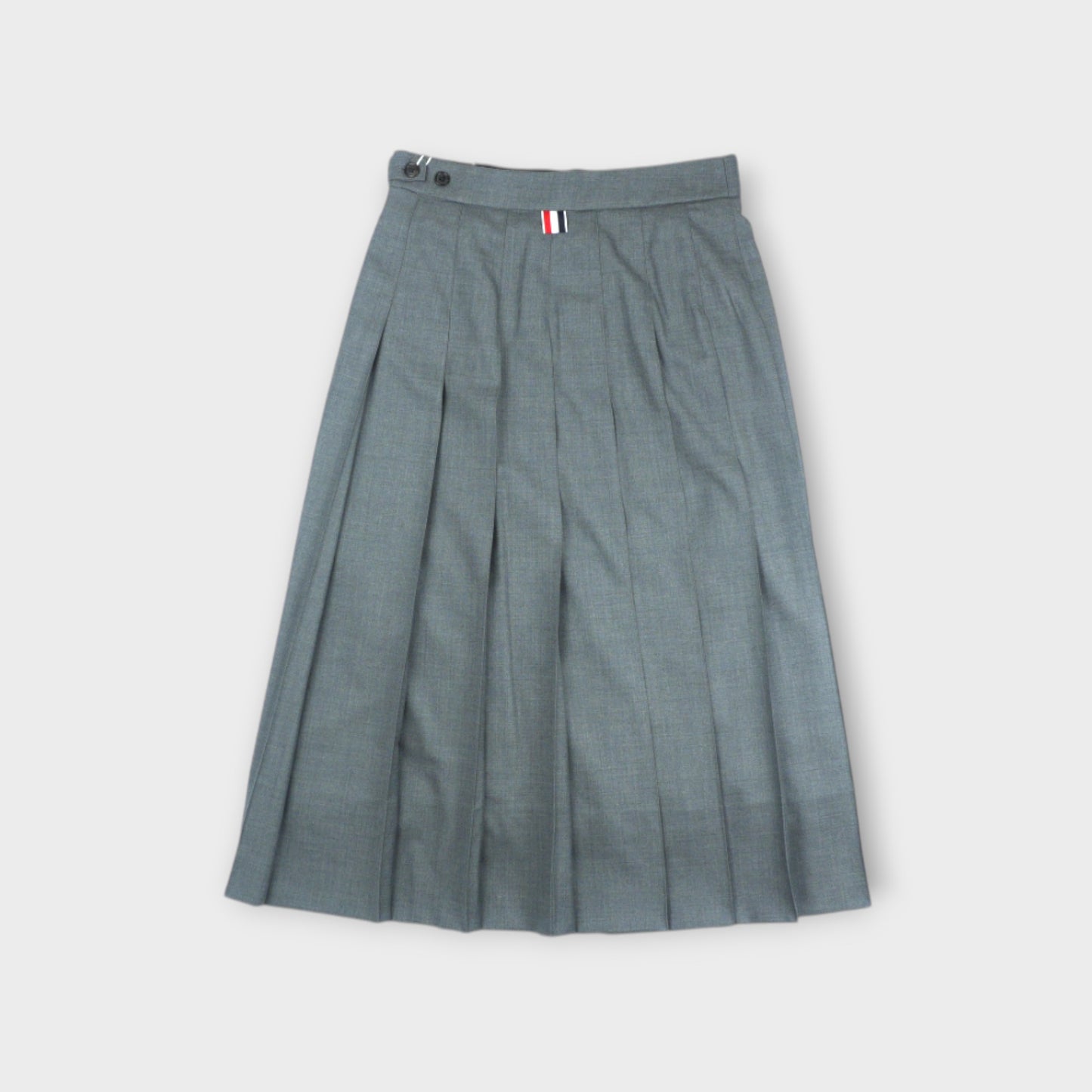 THOM BROWNE BELOW KNEE DROPPED BACK PLEATED SKIRT IN SUPER 120’S TWILL