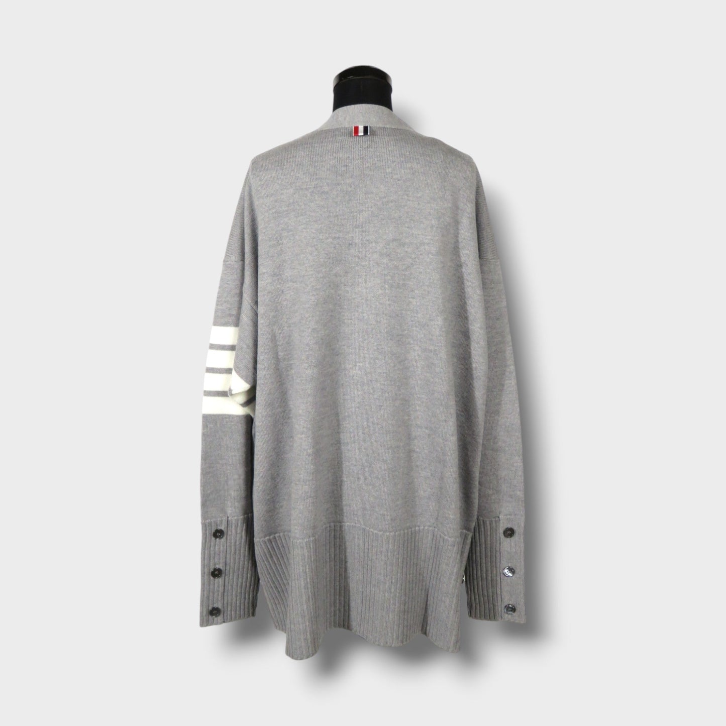 THOM BROWNE EXAGGERATED FIT V NECK CARDIGAN W/ 4 BAR STRIPE IN FINE MERINO WOOL