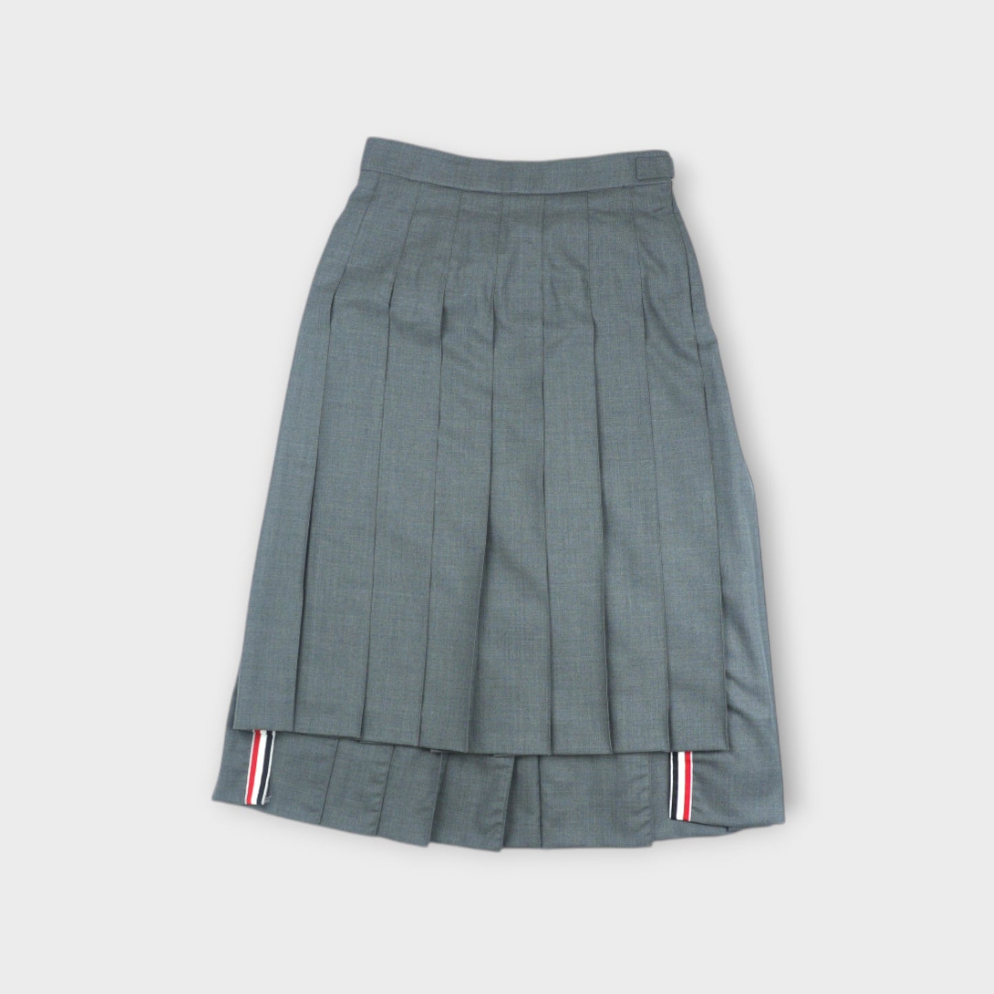 THOM BROWNE BELOW KNEE DROPPED BACK PLEATED SKIRT IN SUPER 120’S TWILL
