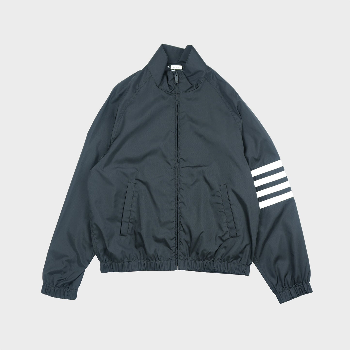 THOM BROWNE ZIP FRONT RAGLAN TRACK JACKET W/ 4 BAR IN SHINY RIPSTOP